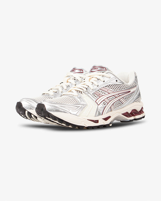 asics shoe, side view, beige shoe, red details