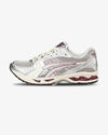 asics shoe, side view, beige shoe, red details
