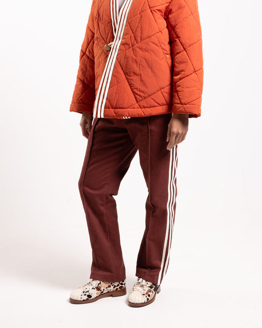 adidas x CLOT Track Pant Fox, brown pants, on model, side view